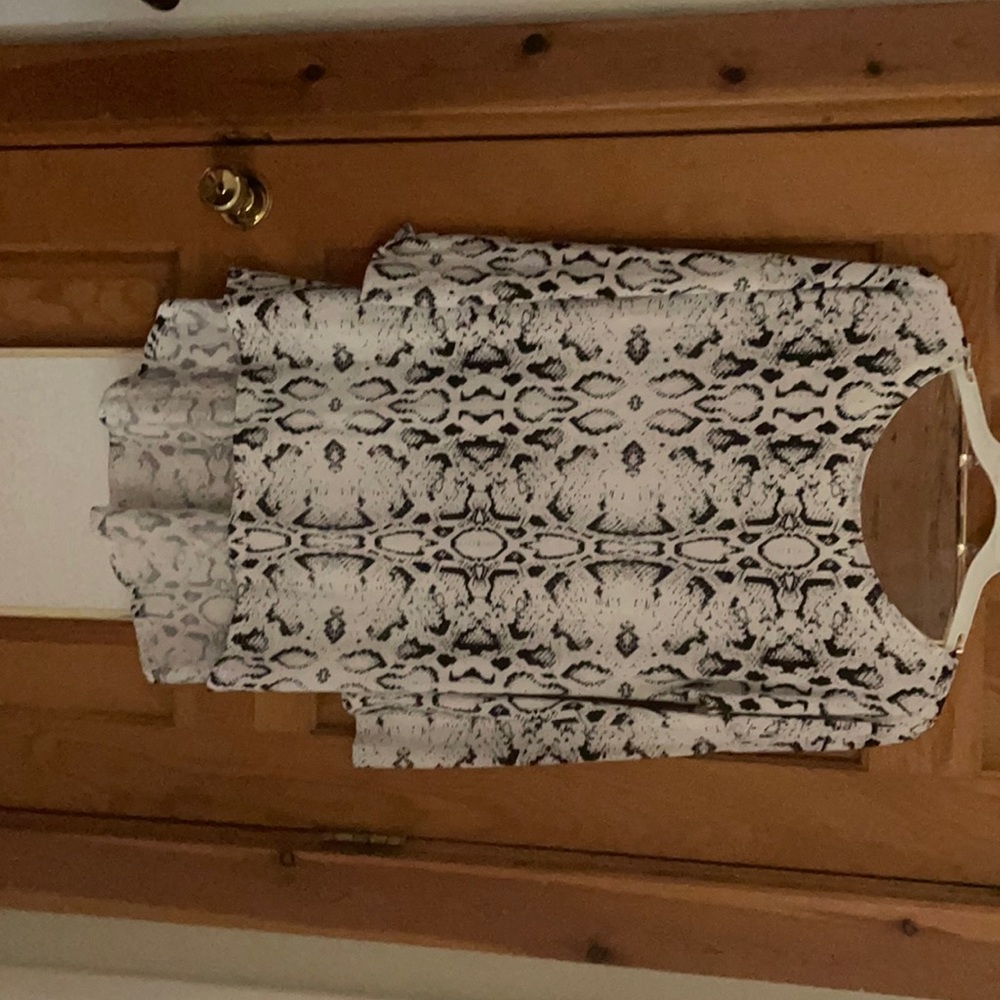 Never worn snakeskin dress.  Would look great with a black belt and boots